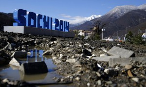 Mud and debris in front of a Sochi sign near the village of Esto Sadok near Sochi, on Feb 2, 2014 - Reuters-Kai Pfaffenbach