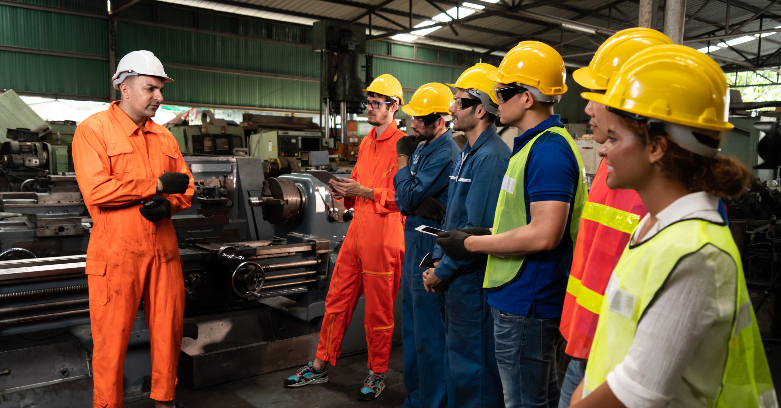 A group of workers listening to a safety talk