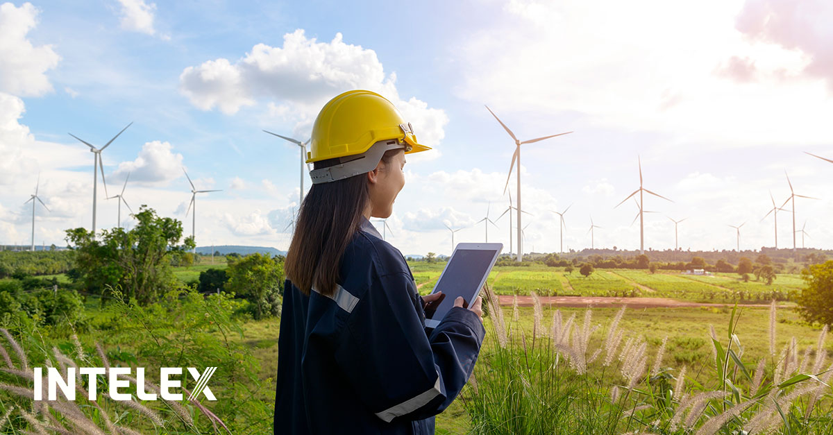 A worker uses ESG software to analze windmill efficiency