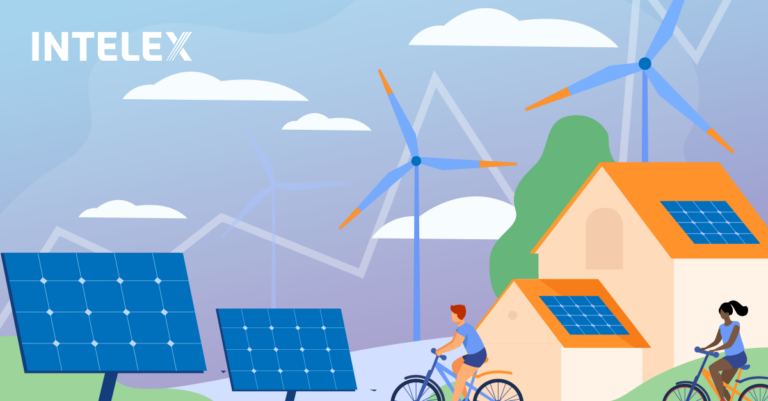 Children bicycle by solar panels, windmills and other sustainability measures.